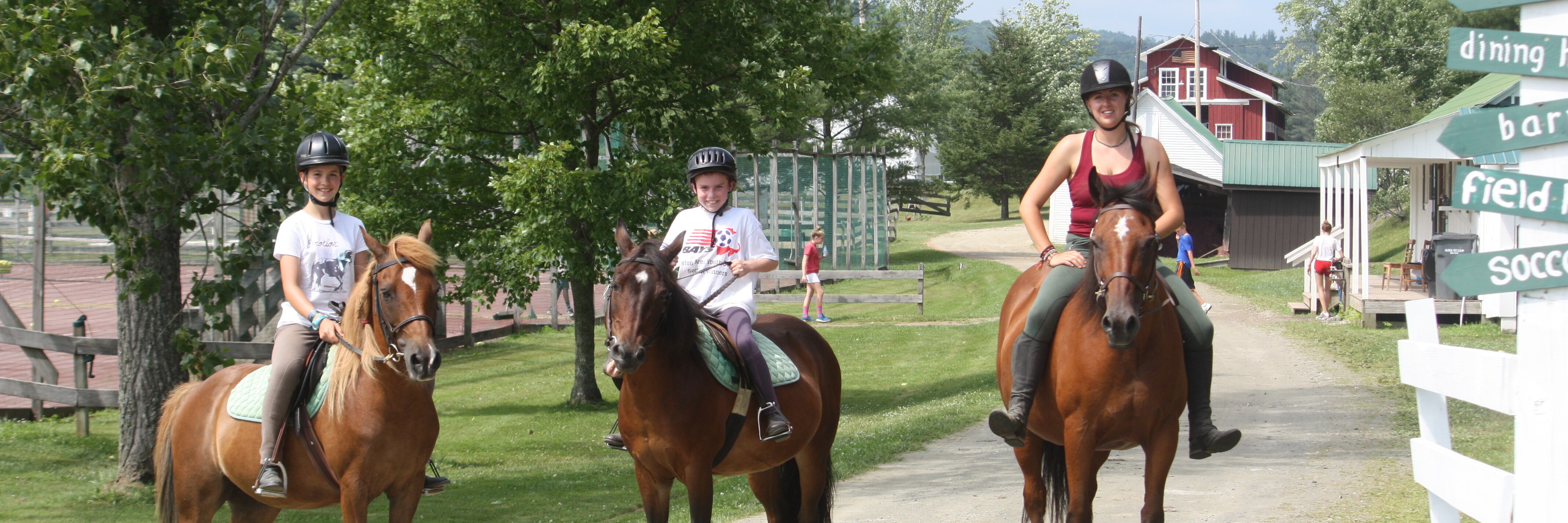 Campers riding horses 