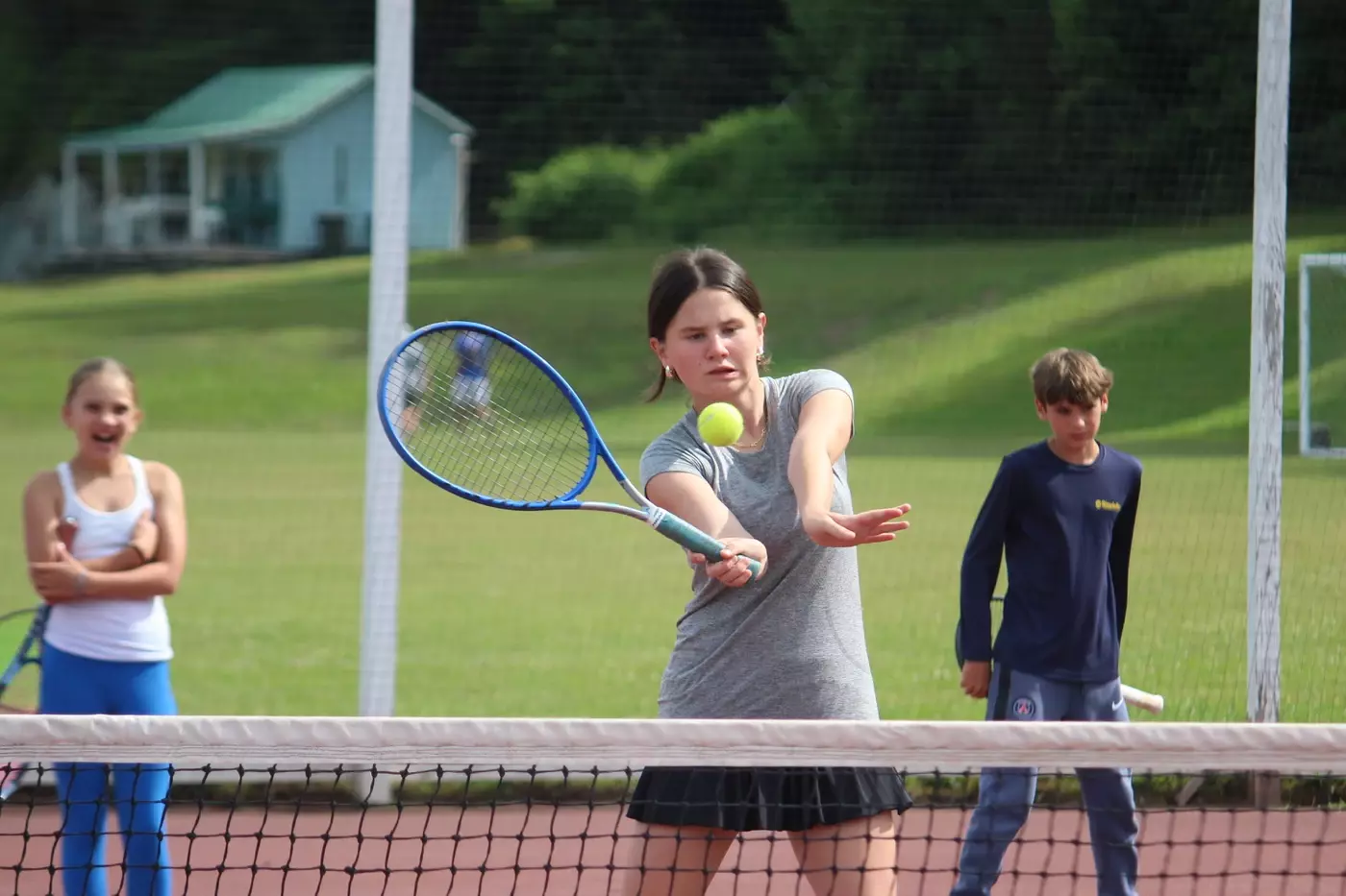 A camper on the tennis court at Windridge