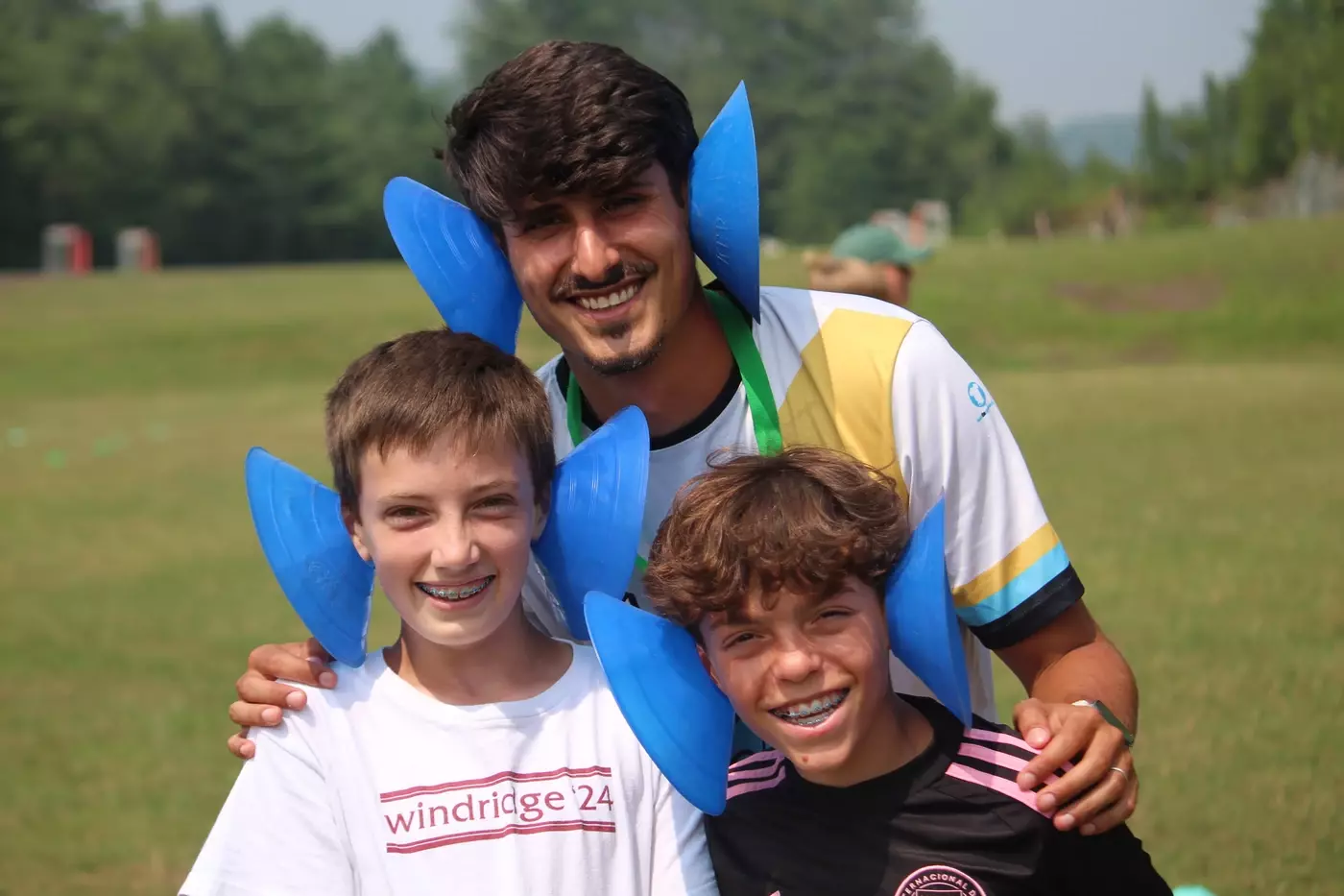 Windridge campers having fun with soccer staff member