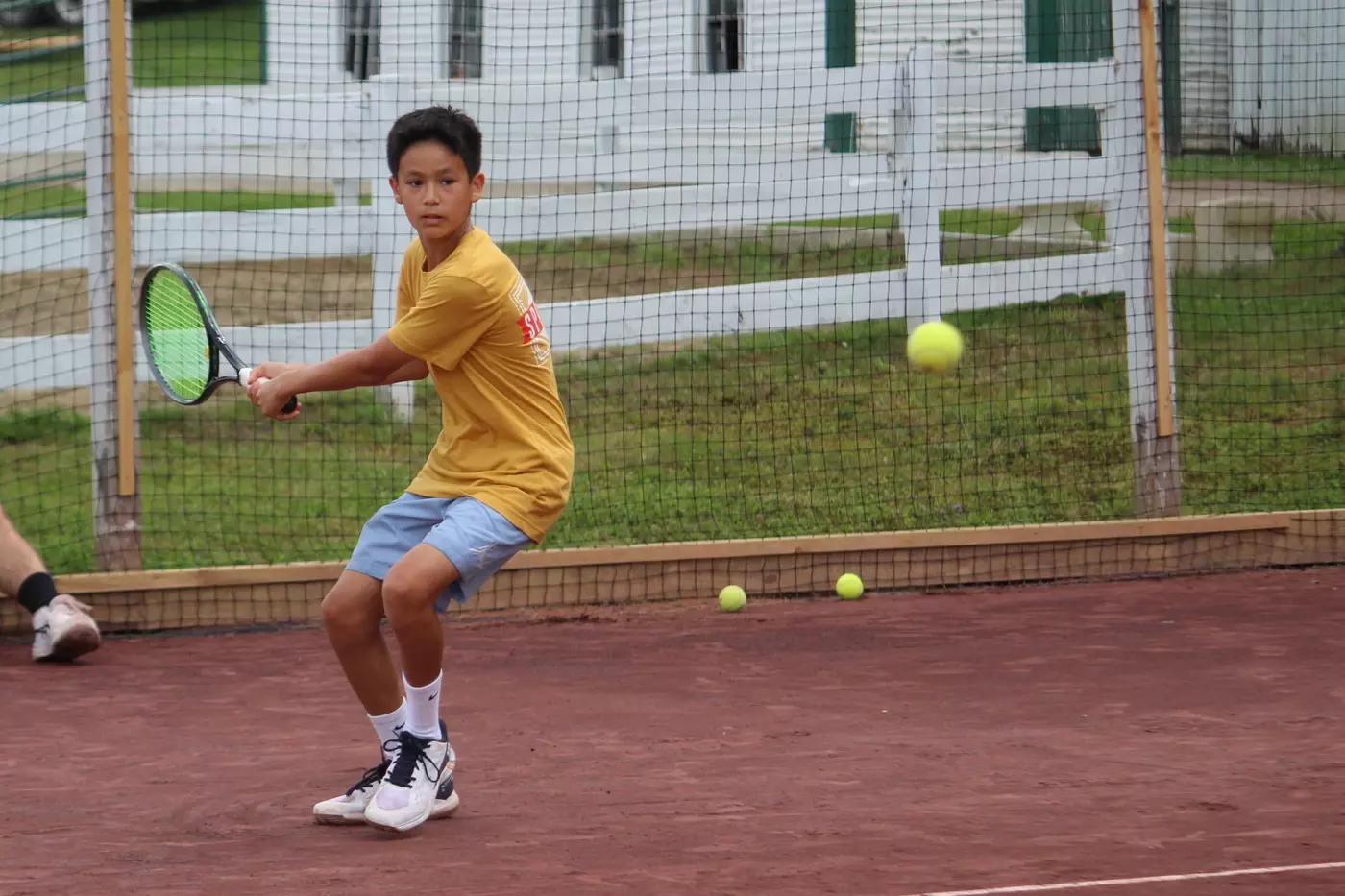 A Windridge camper during a tennis match