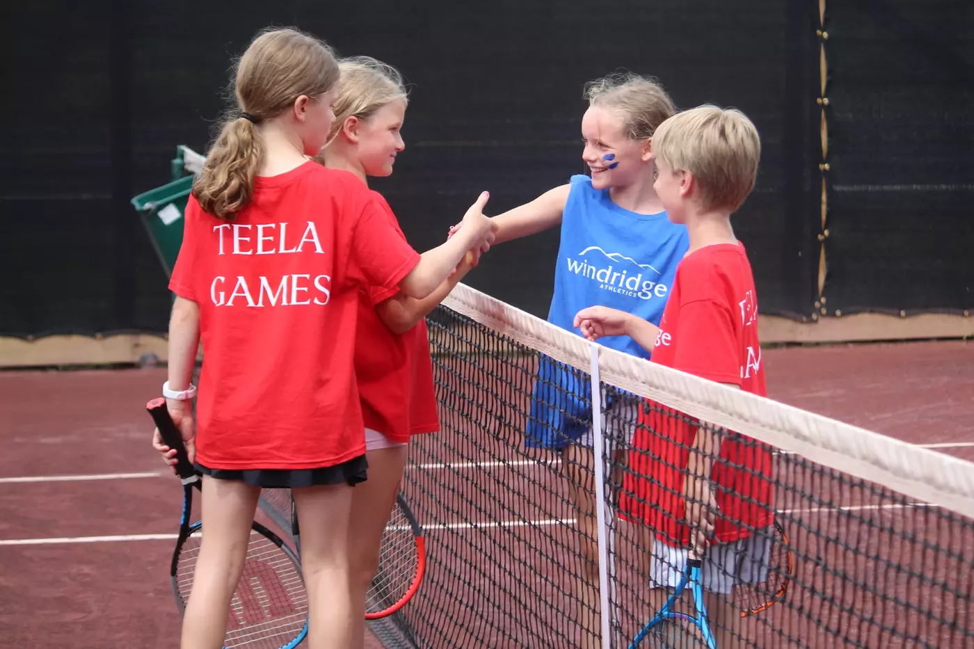 Windridge campers shake hands after a match
