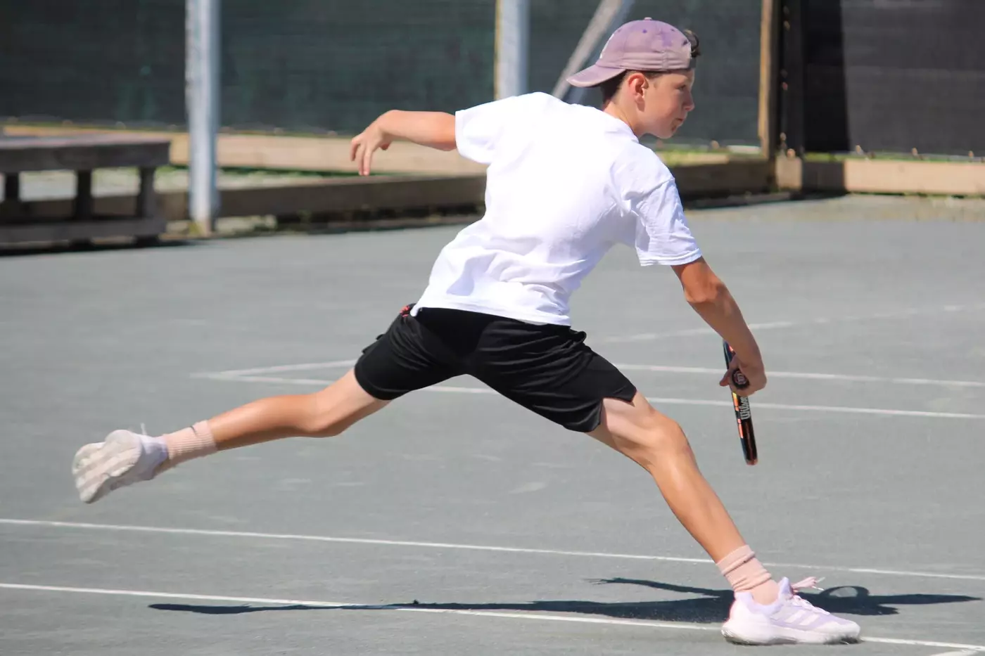 A camper on the har-tru courts at Windridge