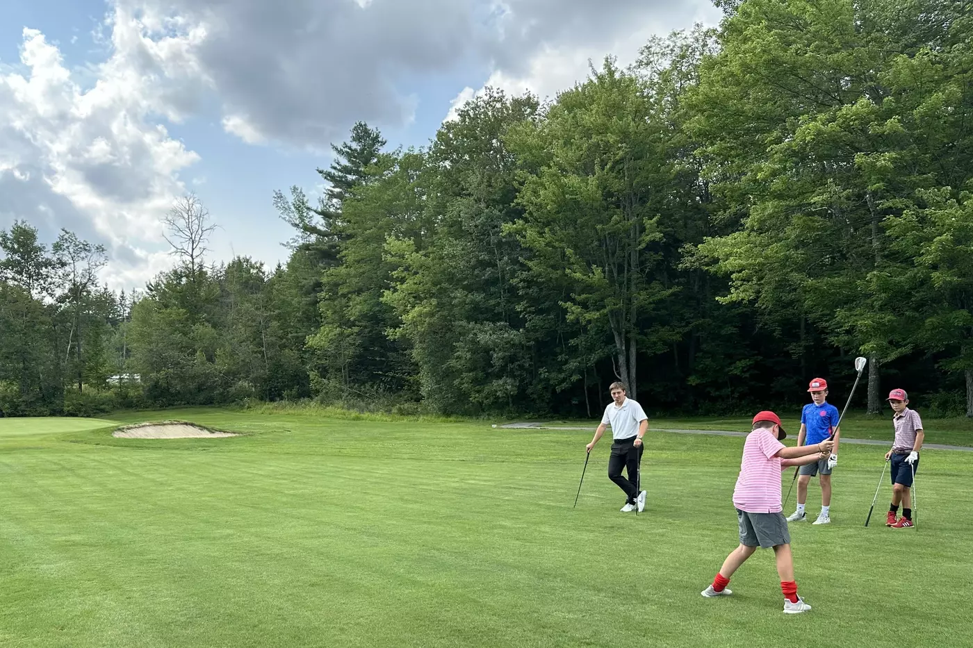 Junior golf campers playing at Northfield Country Club in Vermont.