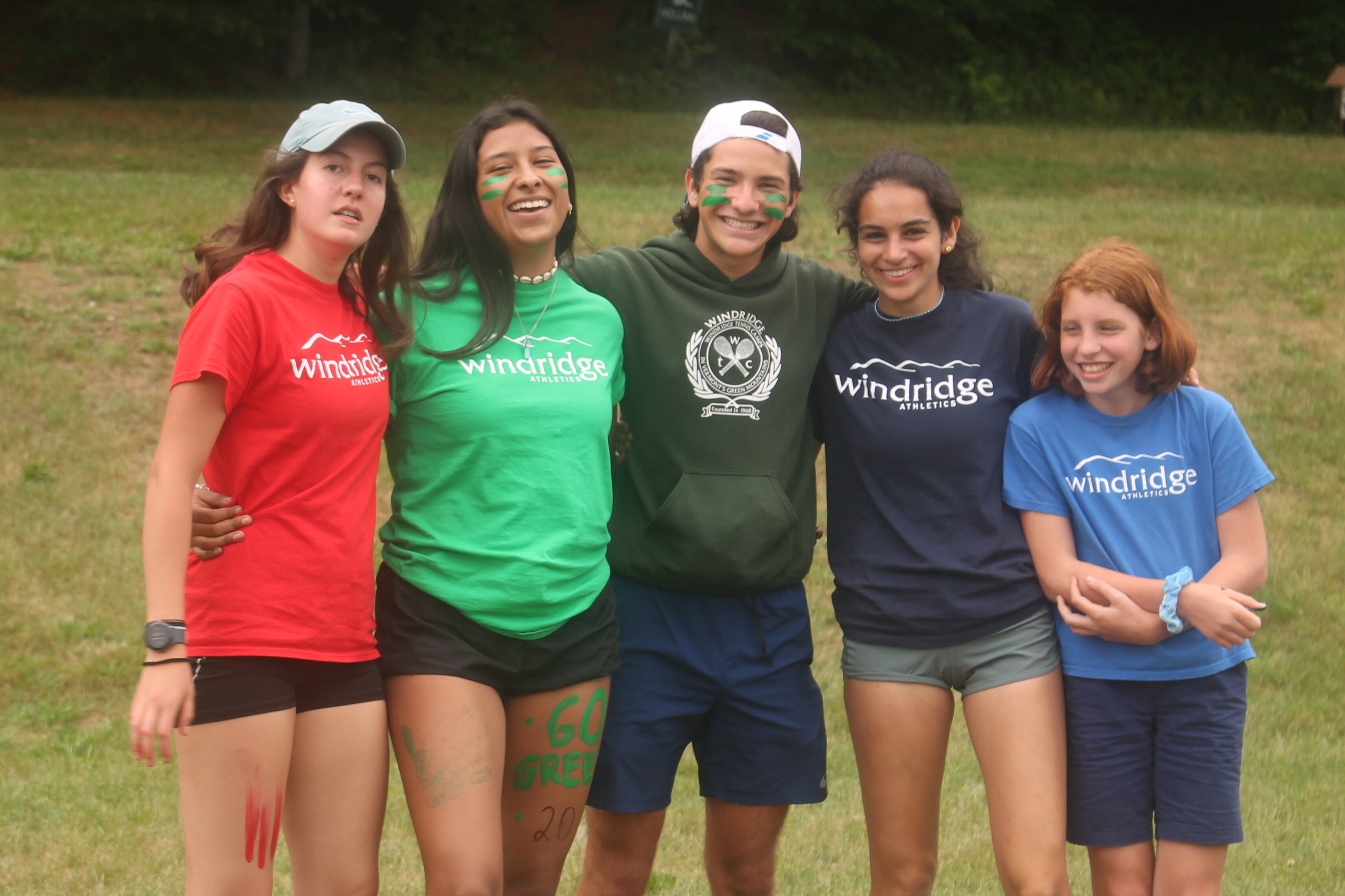 group of campers smiling together outside