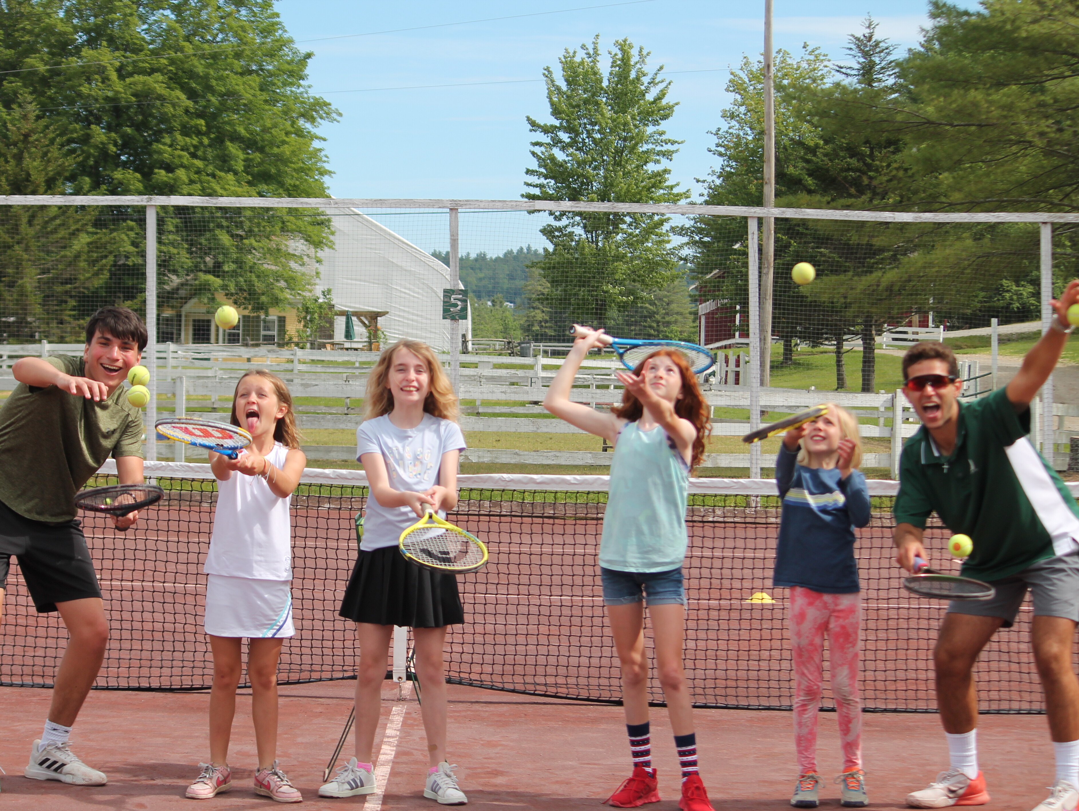 Windridge tennis players on a red clay court